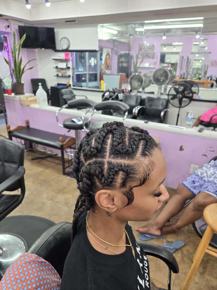 Women's cornrows by Akwaba Hair Braiding